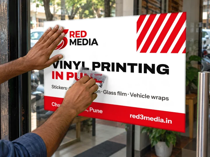 Applying a printed vinyl graphic on glass with a squeegee