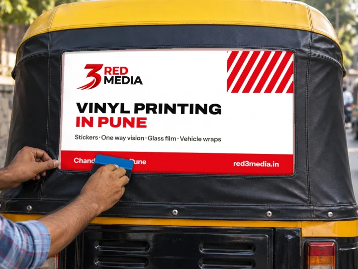 Fitting a printed vinyl back panel on a Pune auto-rickshaw hood with a squeegee