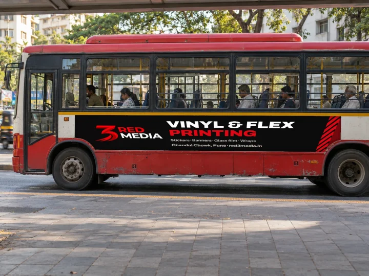 City bus side with a printed vinyl wrap carrying the 3 Red Media logo