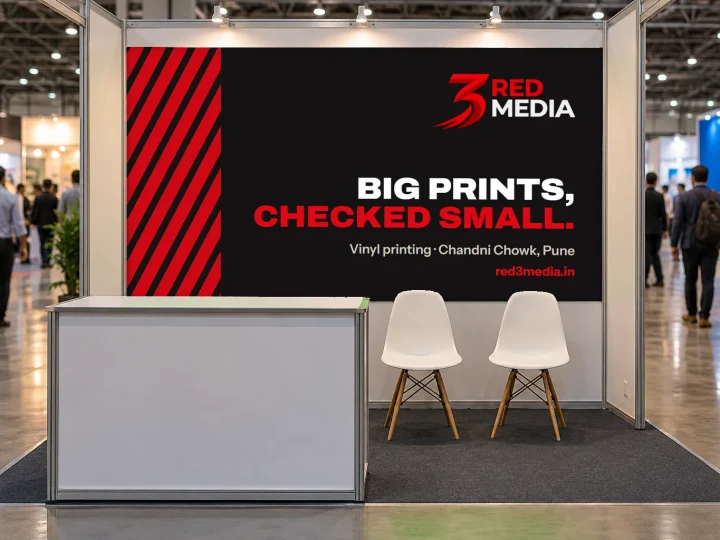 Exhibition stall with 3 Red Media vinyl graphics on the back wall and counter