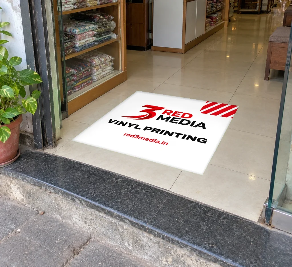 Anti-skid vinyl floor graphic at a store entrance printed by 3 Red Media