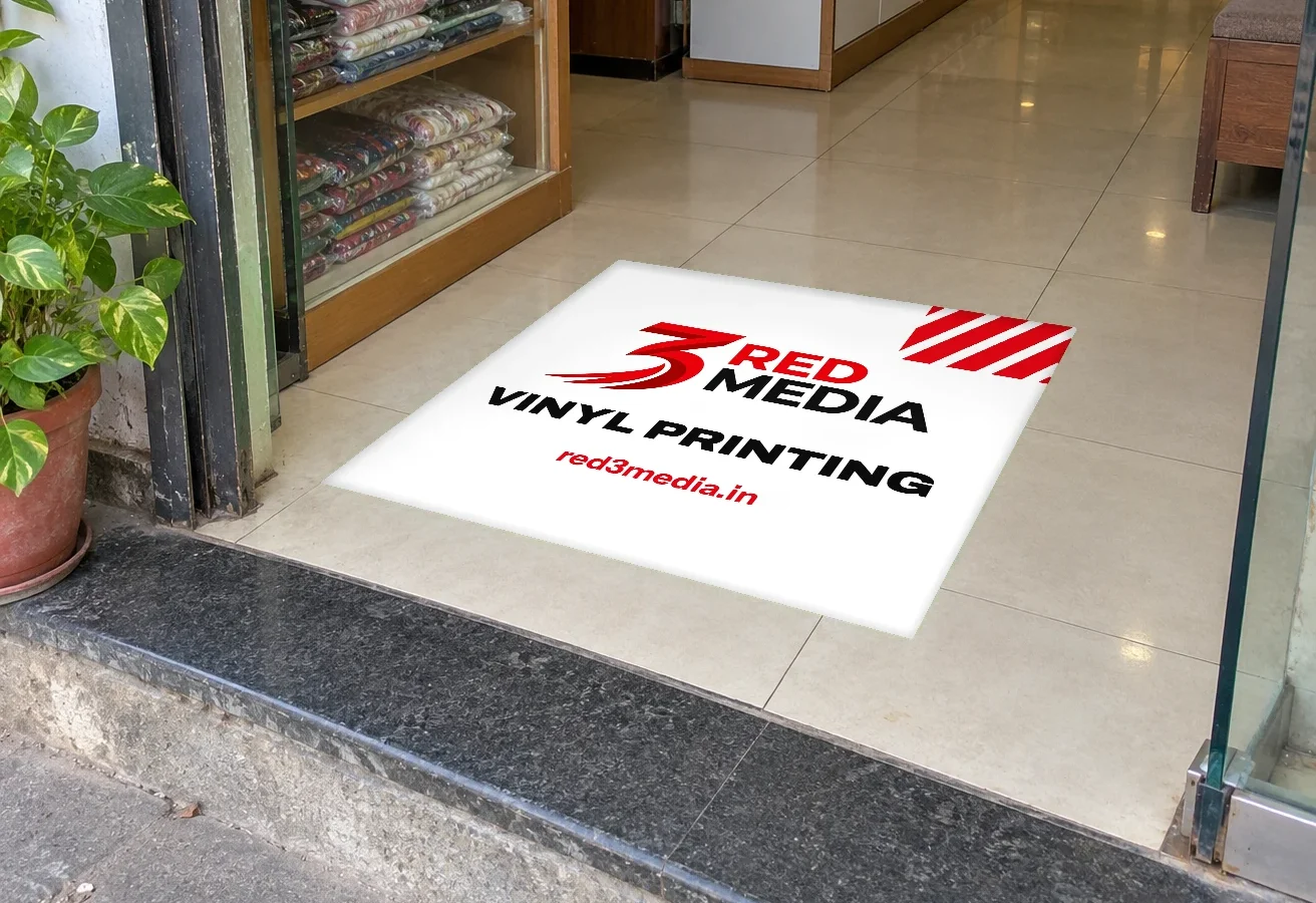 Anti-skid vinyl floor graphic at a store entrance printed by 3 Red Media