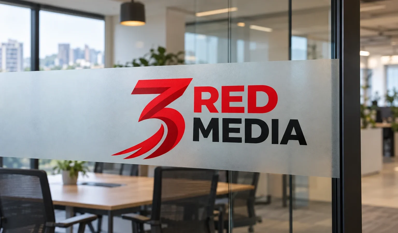 Frosted vinyl privacy band with the 3 Red Media logo on an office glass partition