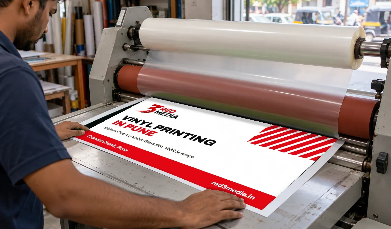 Laminating a printed vinyl sheet at the 3 Red Media print unit