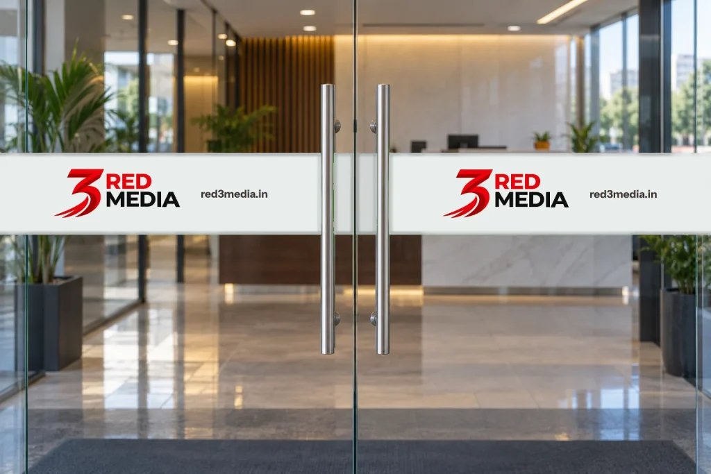 Office glass door with a frosted vinyl band carrying the 3 Red Media logo