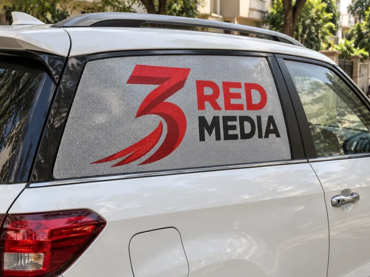 Car rear window with one way vision print showing the 3 Red Media logo