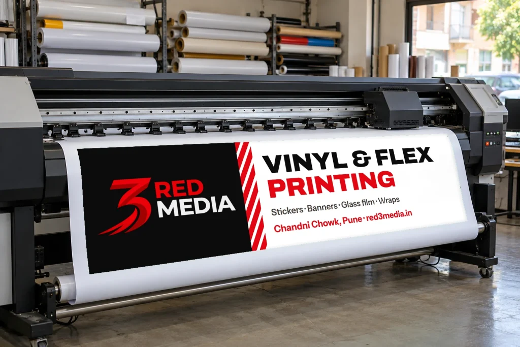 Printed vinyl coming off a large-format printer at the 3 Red Media print unit