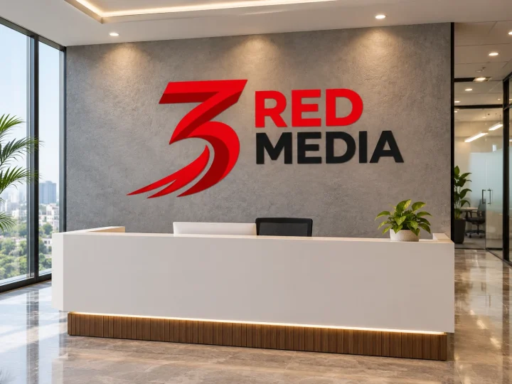 Office reception wall with a large vinyl logo of 3 Red Media