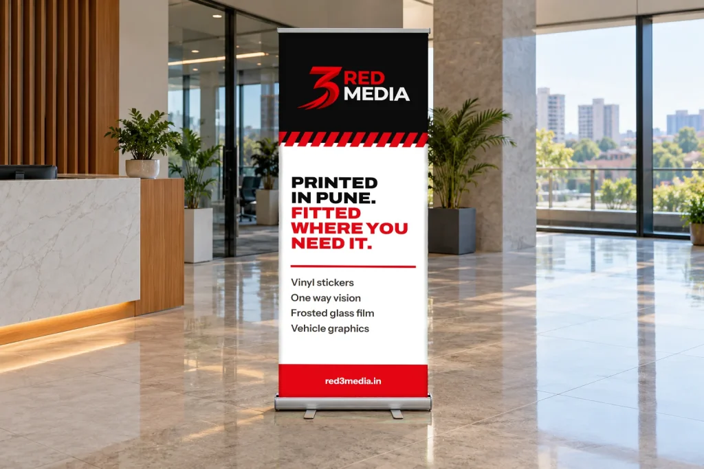 Roll-up standee printed for 3 Red Media in an office lobby