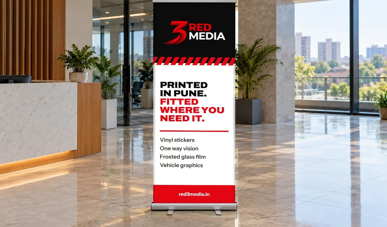 Roll-up standee printed for 3 Red Media in an office lobby