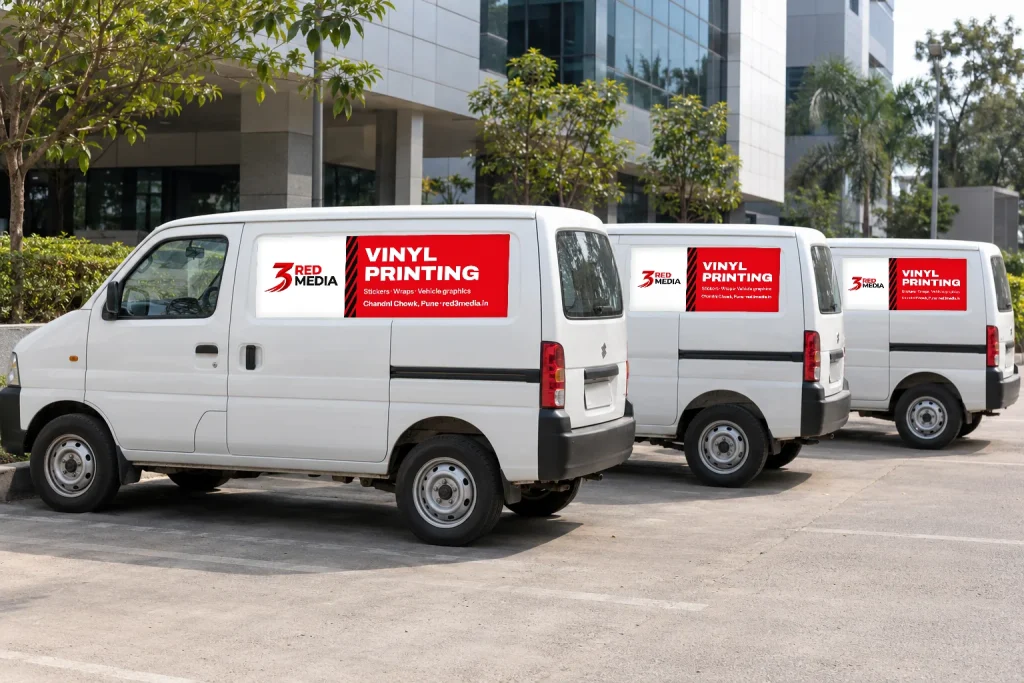 Three white vans in a row, each with the same printed vinyl side panel for 3 Red Media