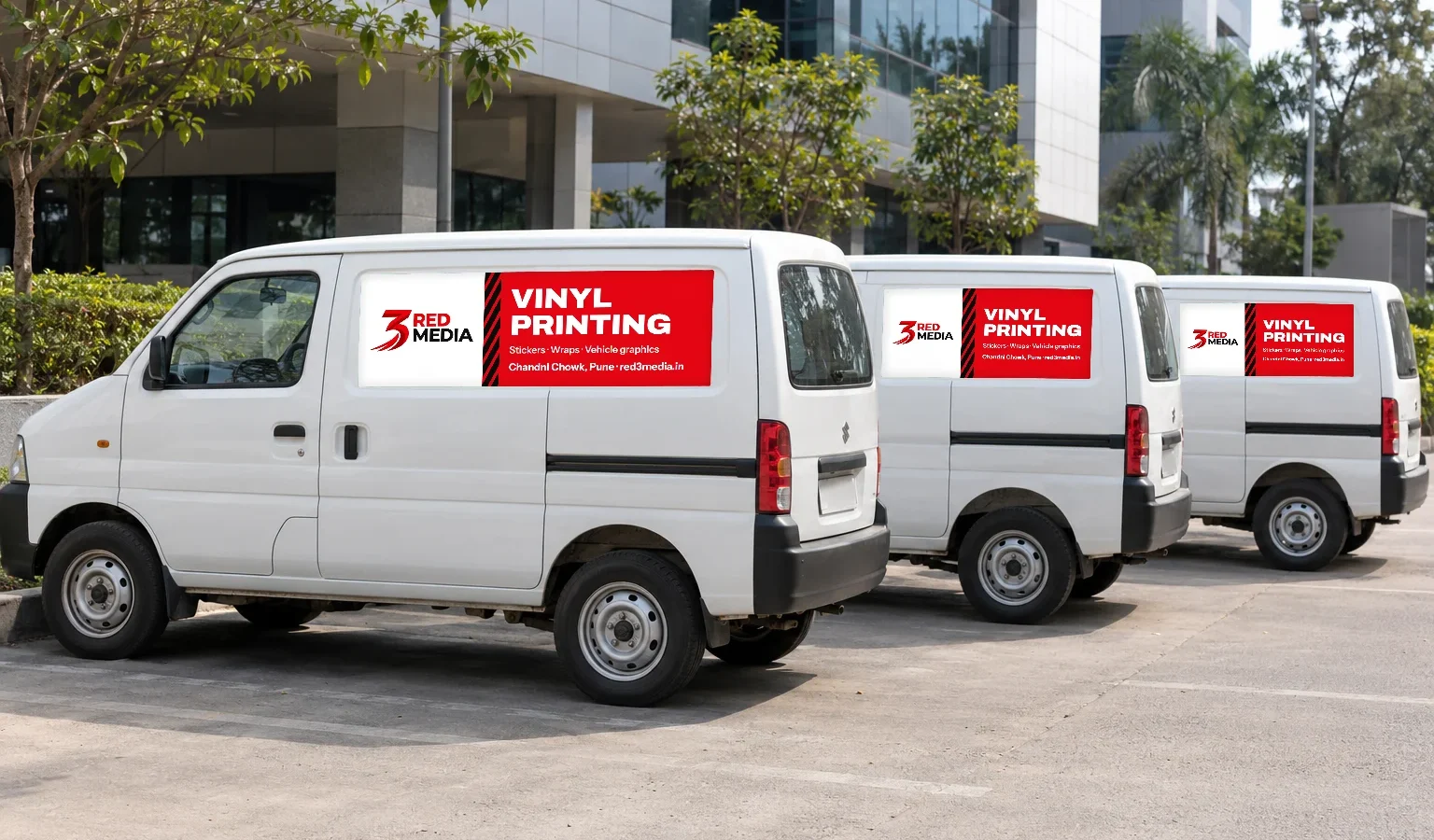 Three white vans in a row, each with the same printed vinyl side panel for 3 Red Media